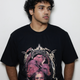 Black oversized t-shirt featuring a bold Tetramorph graphic from Revelation, with the faces of a lion, ox, eagle, and man framed by jagged lightning-like branches. Modeled here as a standalone piece in the grunge Indian Christian streetwear line.
